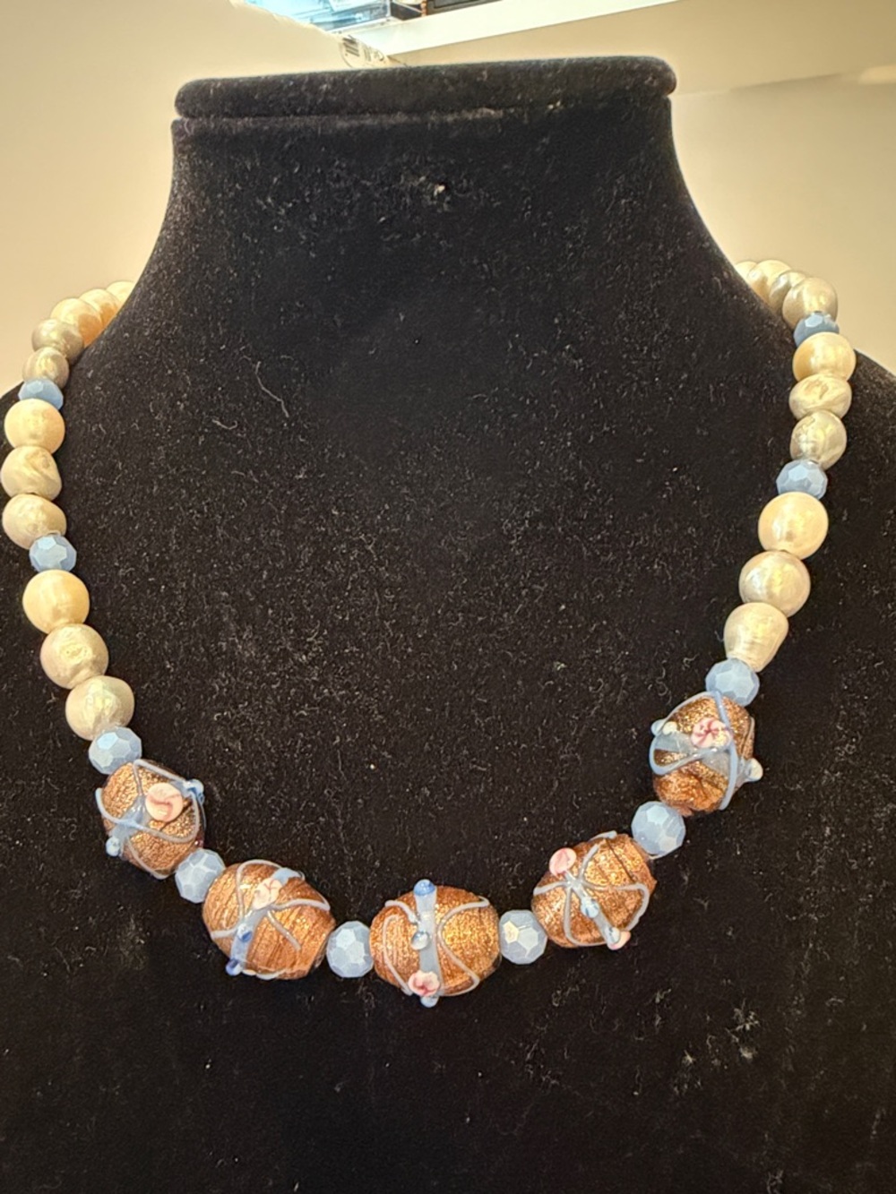 Hand Crafted Blue and Gold Artisan Bead Necklace 22 “ with antique gold clasp.